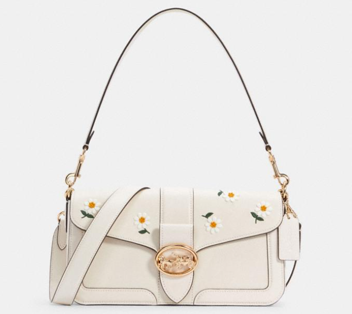 white coach bag with daisies