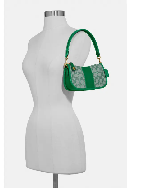 coach swinger bag in signature jacquard green