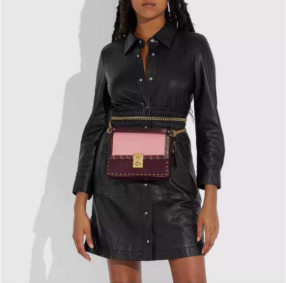 $297 (原价 $495) + 免邮Macy s官网 COACH X Jennifer Lopez Hutton 粉色小方包6折热卖 