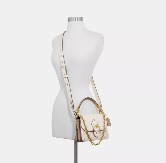 $270 (原价 $450) + 免邮Macy s官网 Coach Beat 18 马车图案印花单肩包6折特卖 