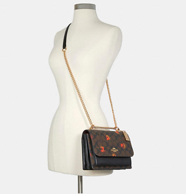 $189 (原价 $378) + 免邮Coach Outlet官网 Coach Klare 老花小牛皮风琴包5折热卖 