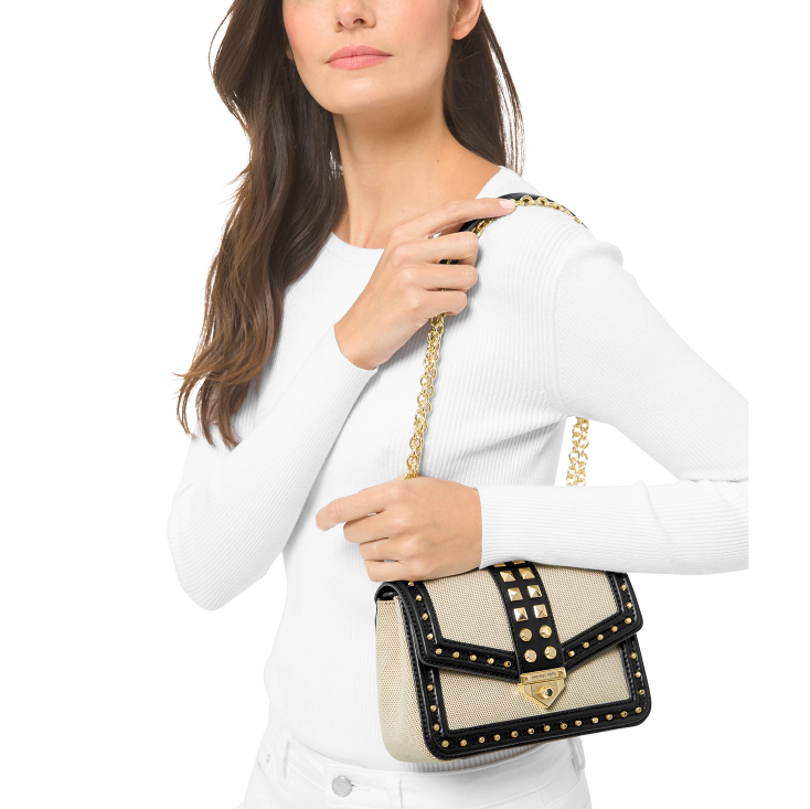 这款MK铆钉单肩包采用帆布和皮革制成