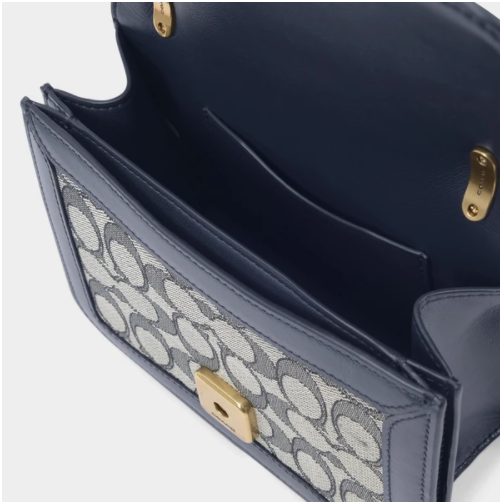 $346.50 (原价 $495) + 免邮MONNIER Frères官网 Coach Alie 蓝色帆布斜挎包7折热卖  