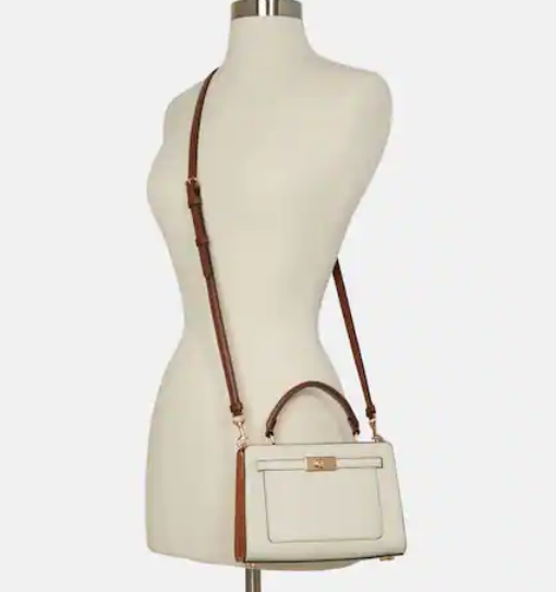 $164 (原价 $328) + 免邮Coach Outlet官网 Coach Mini Lane 白色手提包5折热卖 