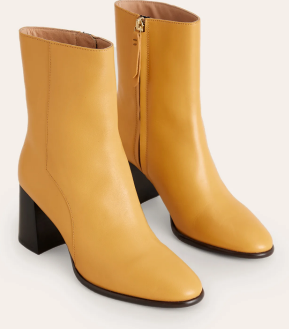 The Heather ankle boots are a classic style for everyday outfitting. They have a sturdy block heel and come in a choice of patent leather or suede. The Heather ankle boots are a classic style for everyday outfitting. They have a sturdy block heel and come in a choice of patent leather or suede.