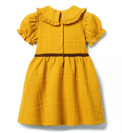 A soft quilted dress with a touch of equestrian style. We love the sueded waist detail A soft quilted dress with a touch of equestrian style. We love the sueded waist detail